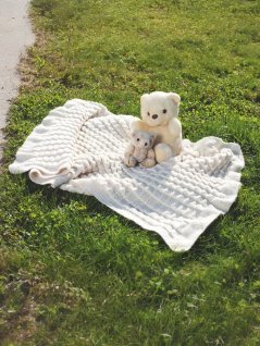 Plisseret strikket babyteppe